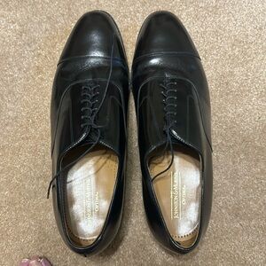 Johnston & Murphy “Optima” Melton black dress shoes.